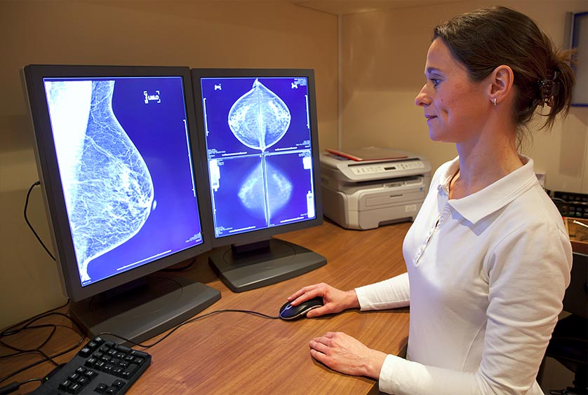 Gynecological Imager examining Breast Imaging on her computer